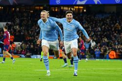 Soccer-Manchester City claim top spot after recovering to beat Leipzig 3-2