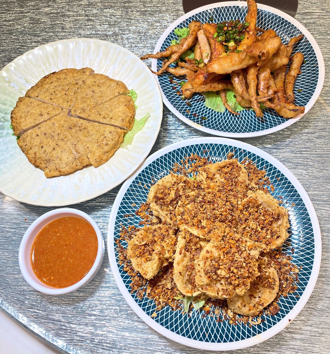 Pan-fried chicken meat cake, crispy stuffed beancurd skin and deep-fried squid as appetisers.