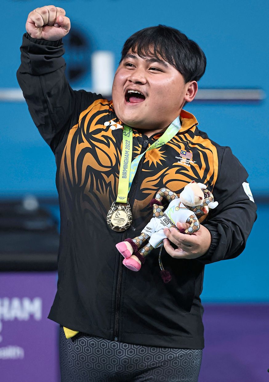 Uplifting: Bonnie Bunyau Gustin won his first Asian Para Games powerlifting gold.