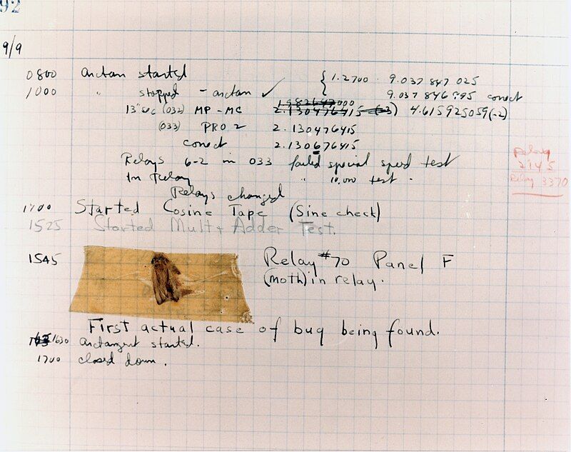 A page from the Harvard Mark II electromechanical computer's log, featuring a dead moth that was removed from the device.