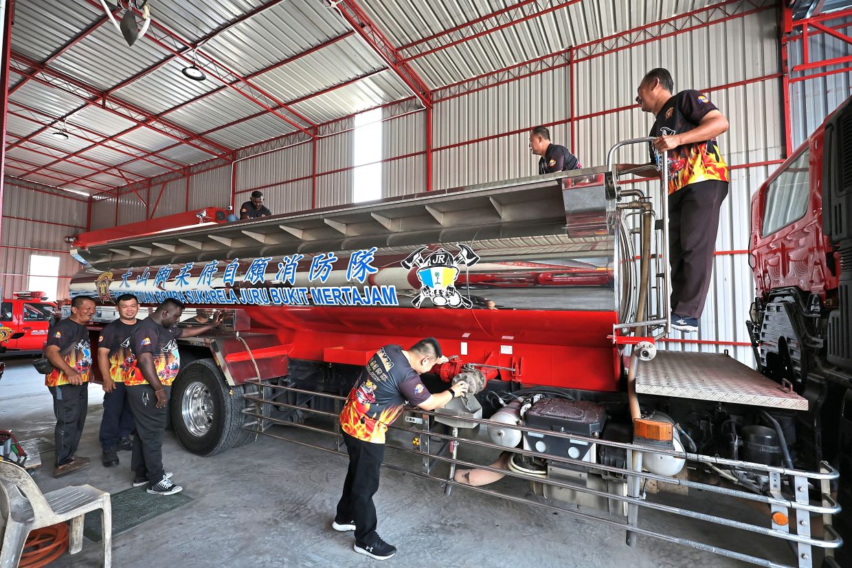 Members of Juru Volunteer Fire Brigade in Bukit Mertajam inspecting their tanker lorry, ready to help provide water during the scheduled cut next week.