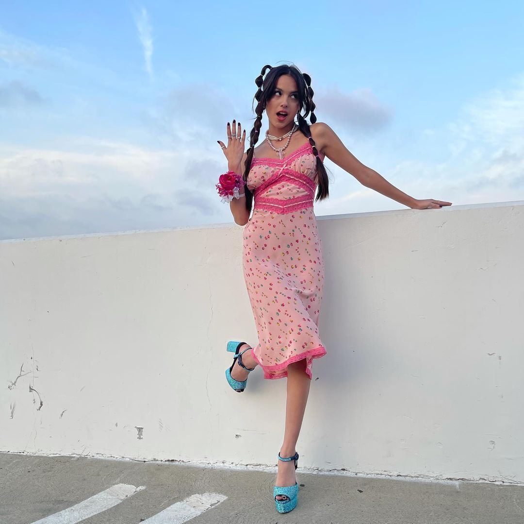Olivia Rodrigo sports the full trend with a laced dress, block heels and pearl jewellery. Photo: Instagram/Olivia