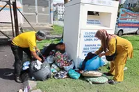 Recycling bins overflowing with uncollected bags of clothing an eyesore in Sepang