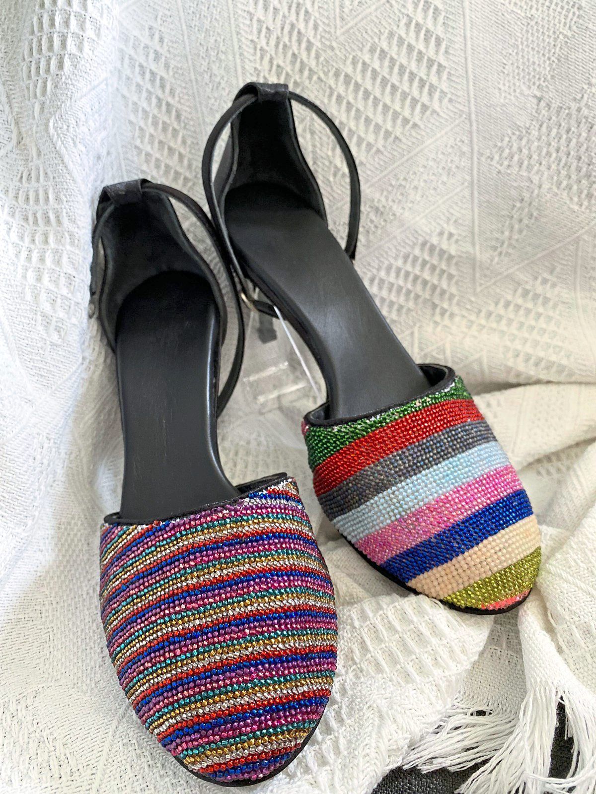 Beading embroidery as well as business acumen in shoe-making.