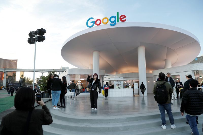An attendee has her photo taken in front of the Google house at CES 2024 an annual consumer electronics trade show in Las Vegas Nevada U.S. January 10 2024. REUTERSSteve Marcus