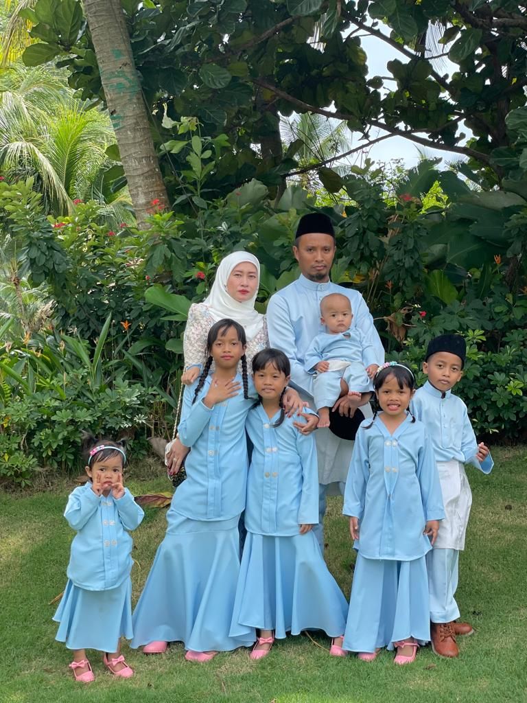 Mohd Izwan and his big family. The engineer says when it comes to shopping, he buys for practicality. — MOHD IZWAN HAMZAH