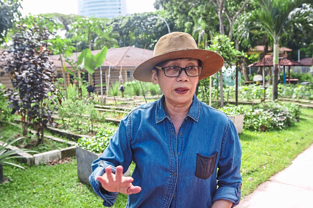 Lau enjoys the therapy of working at the community garden.