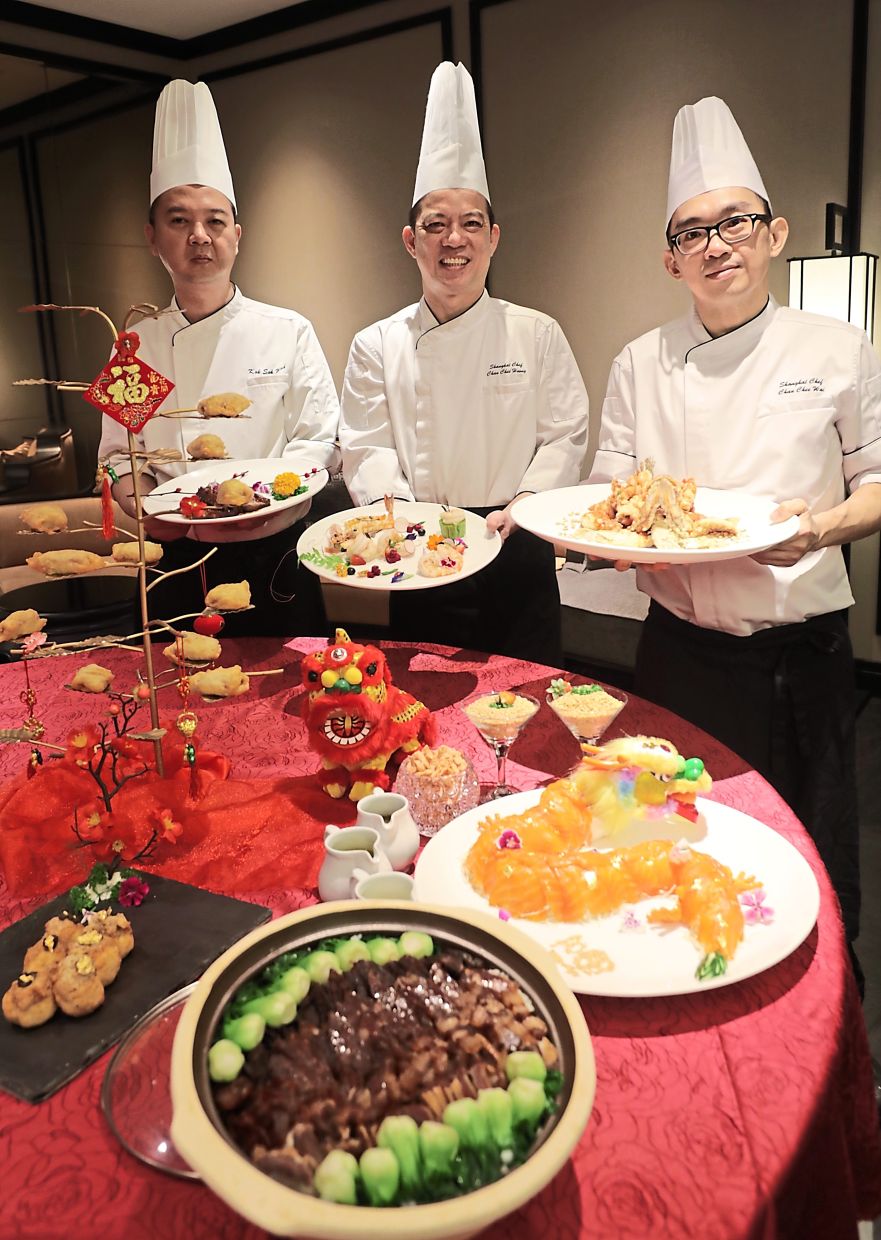 (From left) Chefs Kok Sok Wah, Chan Chee Hoong and Chan Chee Wai with their special Lunar New Year dishes at Shanghai Restaurant, which has earned a spot on the Michelin Selected list.
