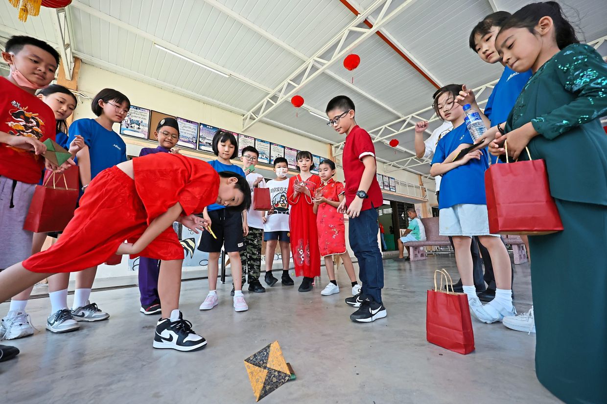 The children playing a game together.— Photos: CHAN BOON KAI/The Star