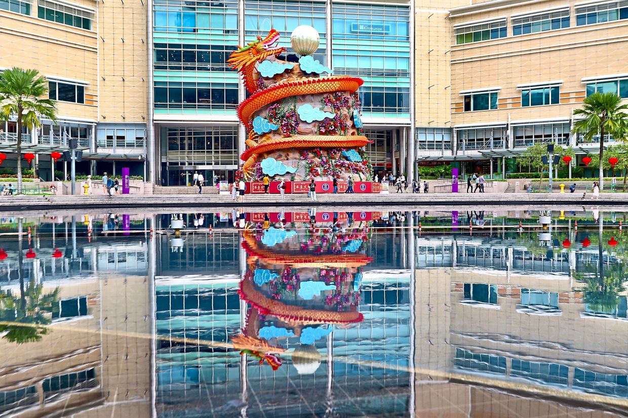 A majestic dragon soars skywards in the heart of the city at KLCC Esplanade. — Photos: FAIHAN GHANI, AZMAN GHANI, AZHAR MAHFOF and CHAN TAK KONG/The Star