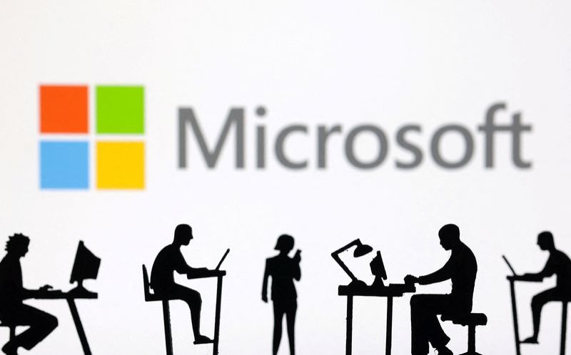 Figurines with computers and smartphones are seen in front of Microsoft Corporation logo in this illustration taken February 19 2024. REUTERSDado RuvicIllustrationFile Photo