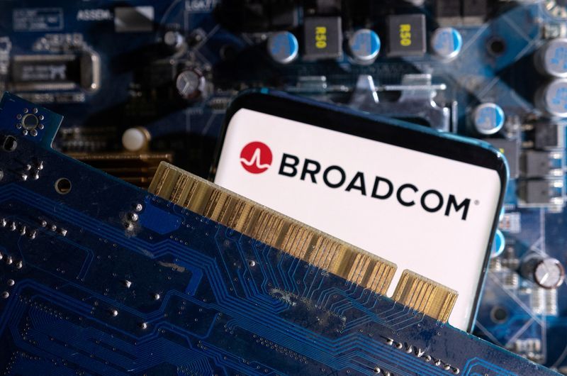 A smartphone with a displayed Broadcom logo is placed on a computer motherboard in this illustration taken March 6 2023. REUTERSDado RuvicIllustrationFile Photo