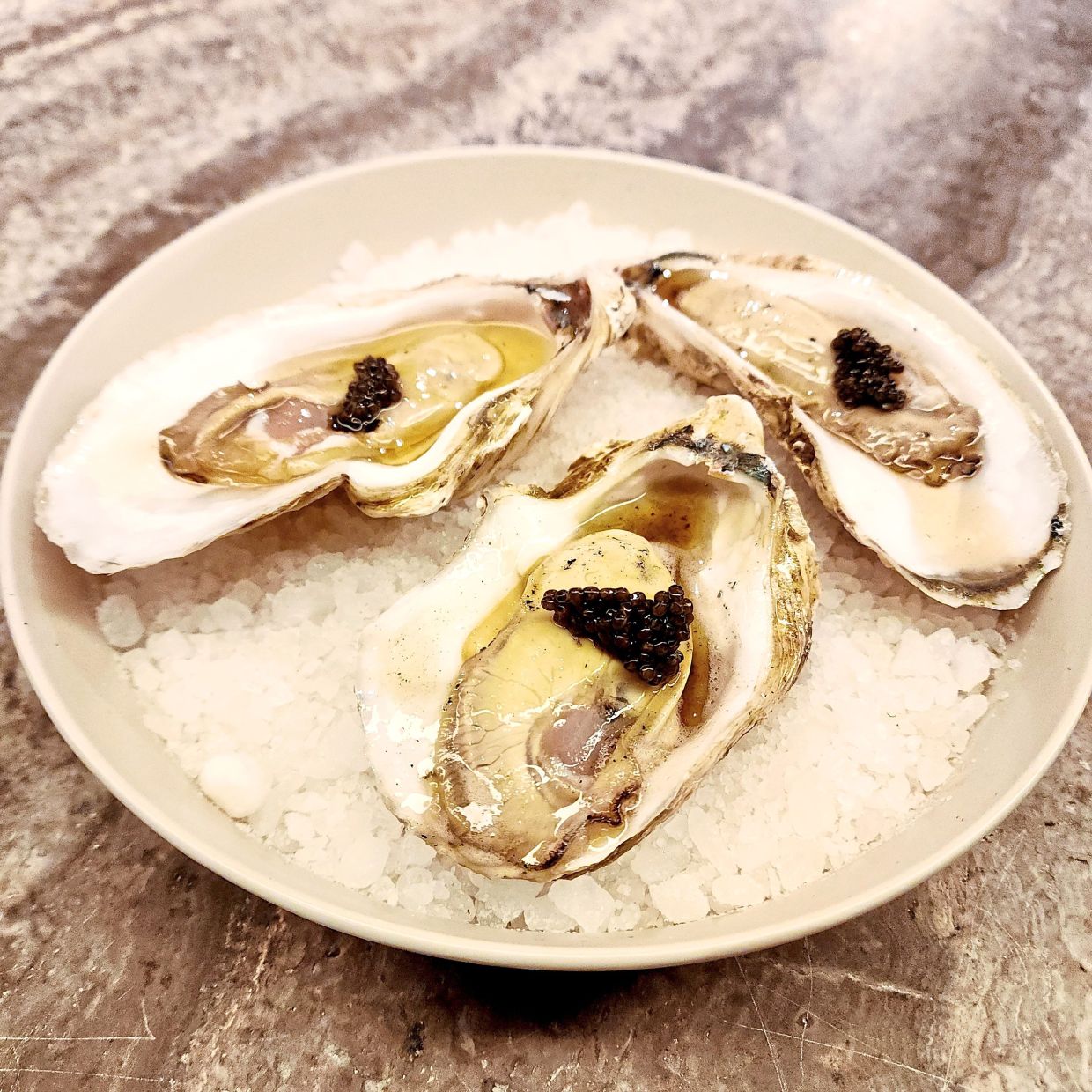 The oysters are lovely on their own and good with the caviar but a little distracting with the addition of the chicken fat. — ABIRAMI DURAI/The Star