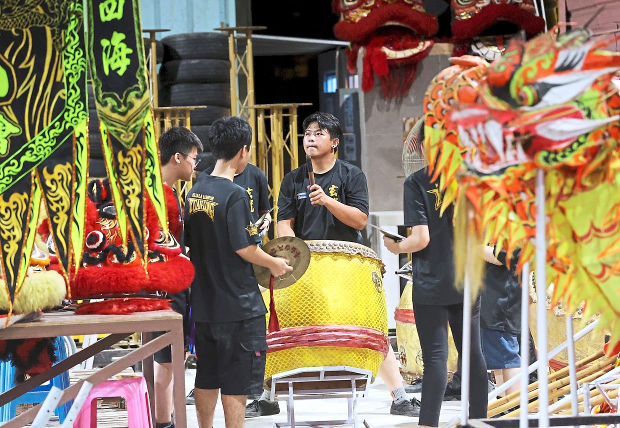 Members of the troupe practising to ensure their movements are synchronised.