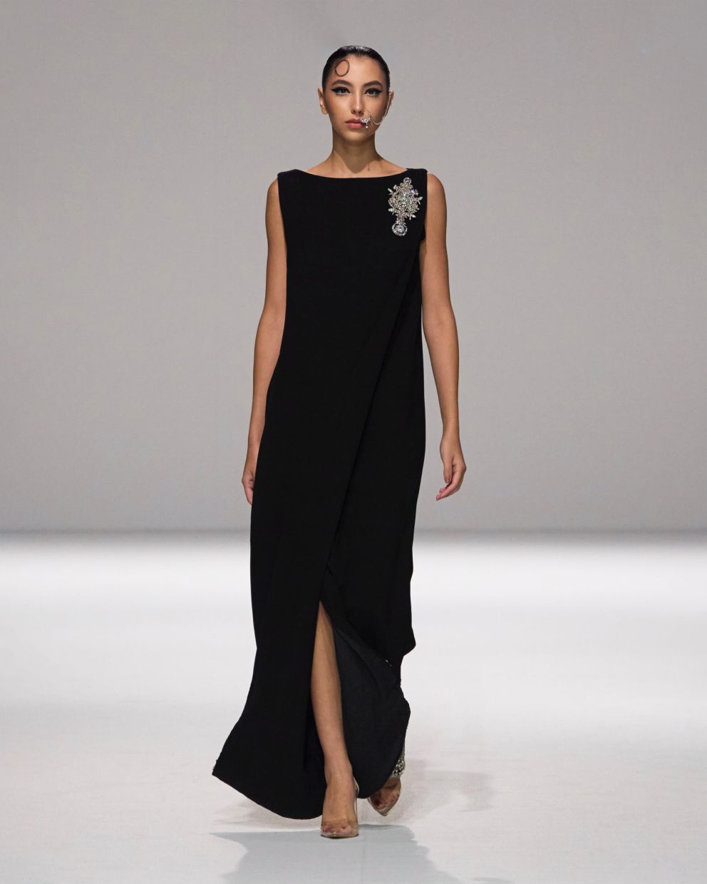 This simple and elegant black dress is a versatile closet staple. Photo: Rizman Ruzaini