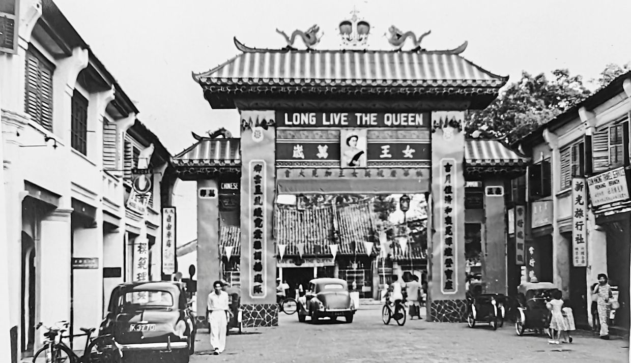 An old photograph in Lim’s collection showing the gateway leading to China Street that was erected in commemoration of the late Queen Elizabeth II’s coronation in 1953.