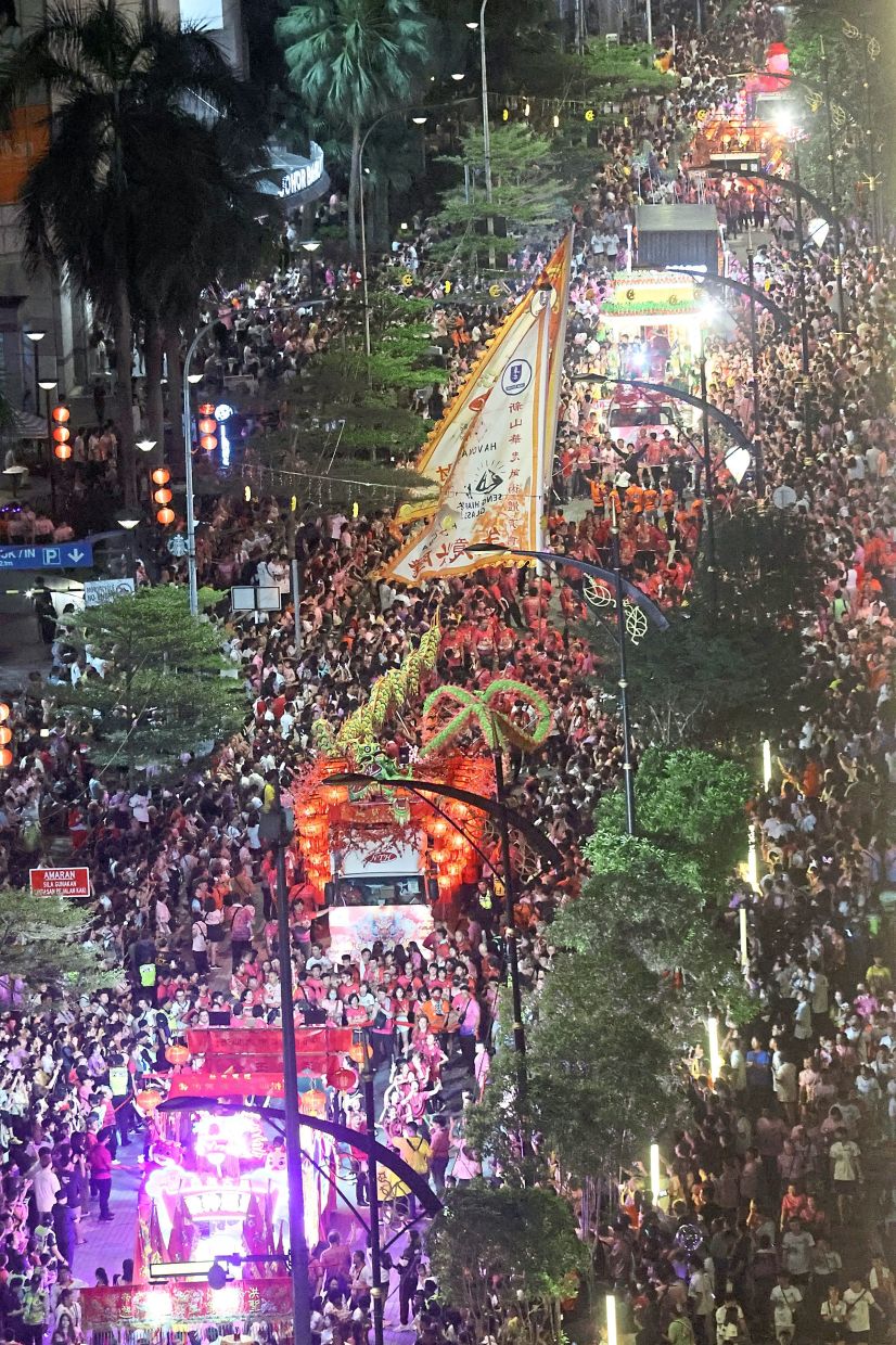 More than 300,000 devotees and spectators showed up to watch the Johor Ancient Temple Chingay procession this year, with the joyful shouts of ‘heng, ong, huat’ (good luck, fortune and prosperity). — Photos: THOMAS YONG/The Star