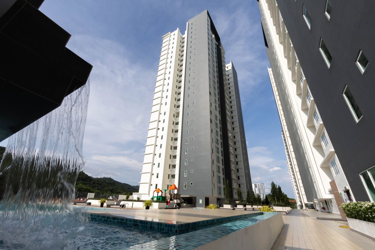 Residents can relax by the infinity pool and unwind against a calming backdrop of green hills