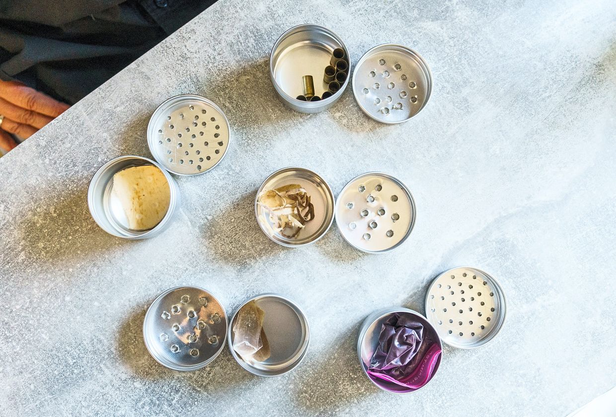 Various metal cans containing odour samples for Kutiva's training. 