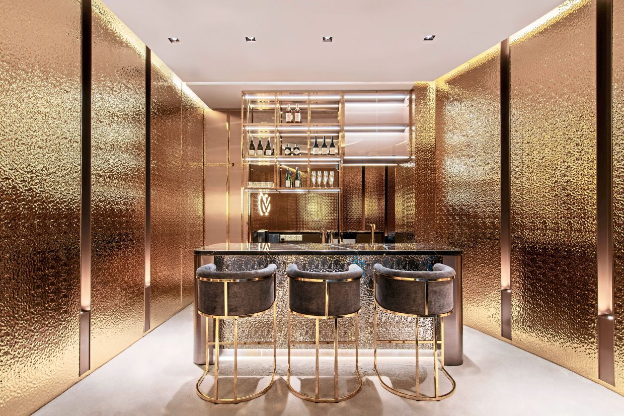 Interior details include luxurious mirror-like reflections and warm tones.