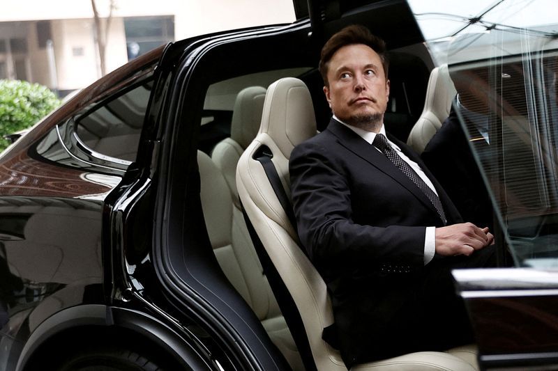 FILE PHOTO Tesla Chief Executive Officer Elon Musk gets in a Tesla car as he leaves a hotel in Beijing China May 31 2023. REUTERSTingshu WangFile Photo