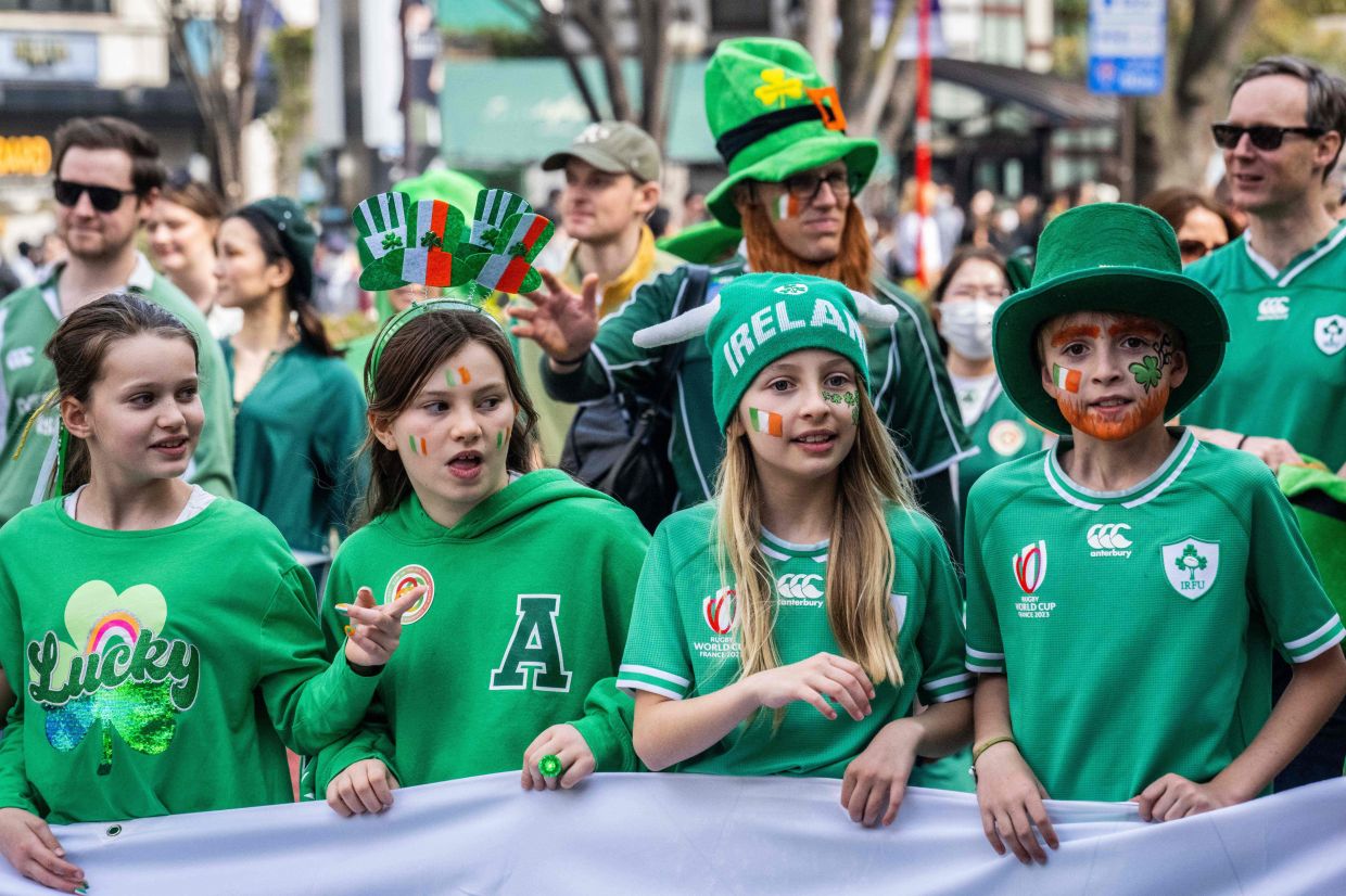 People take part in a St. Patrick's Day parade in Tokyo on Sunday, March 17, 2024. - AFP
