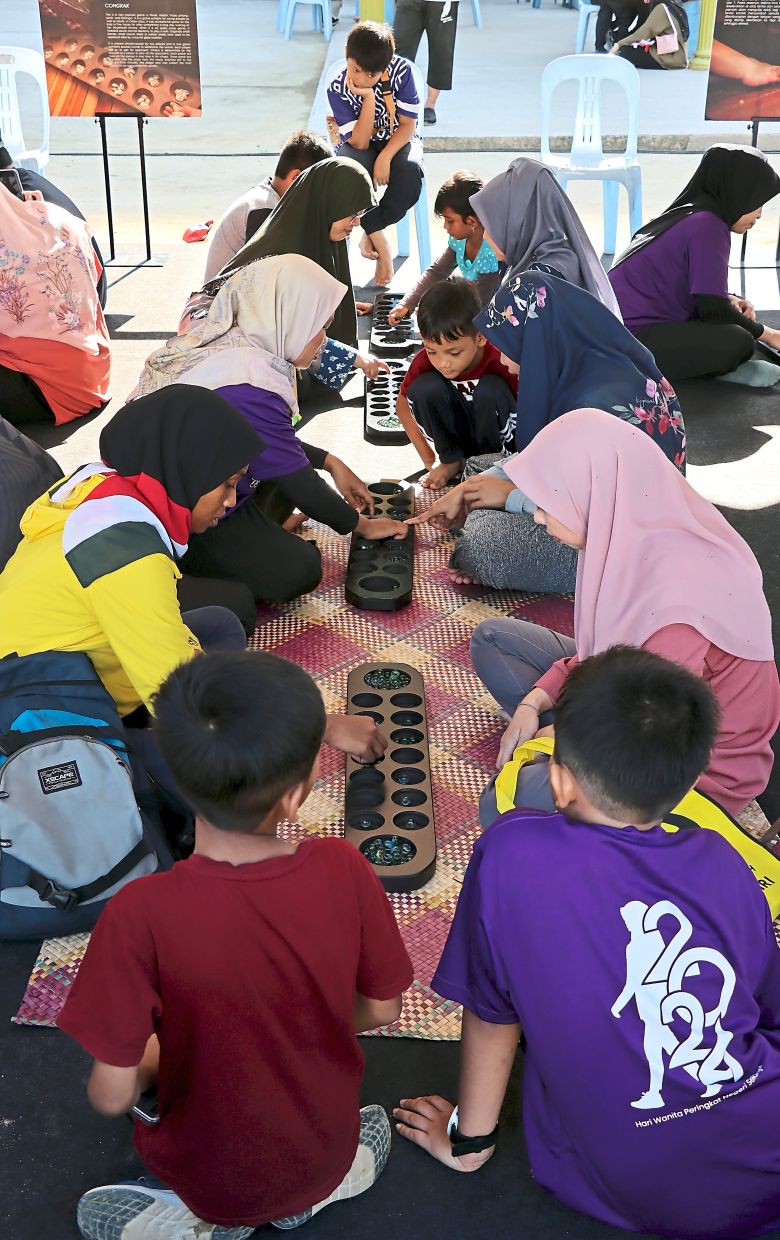 Visitors playing traditional games at the event.