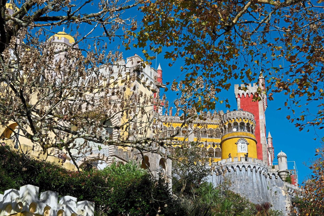 The Palacio de Pena is a kaleidoscope of clashing colours that would have been Barbie’s envy.