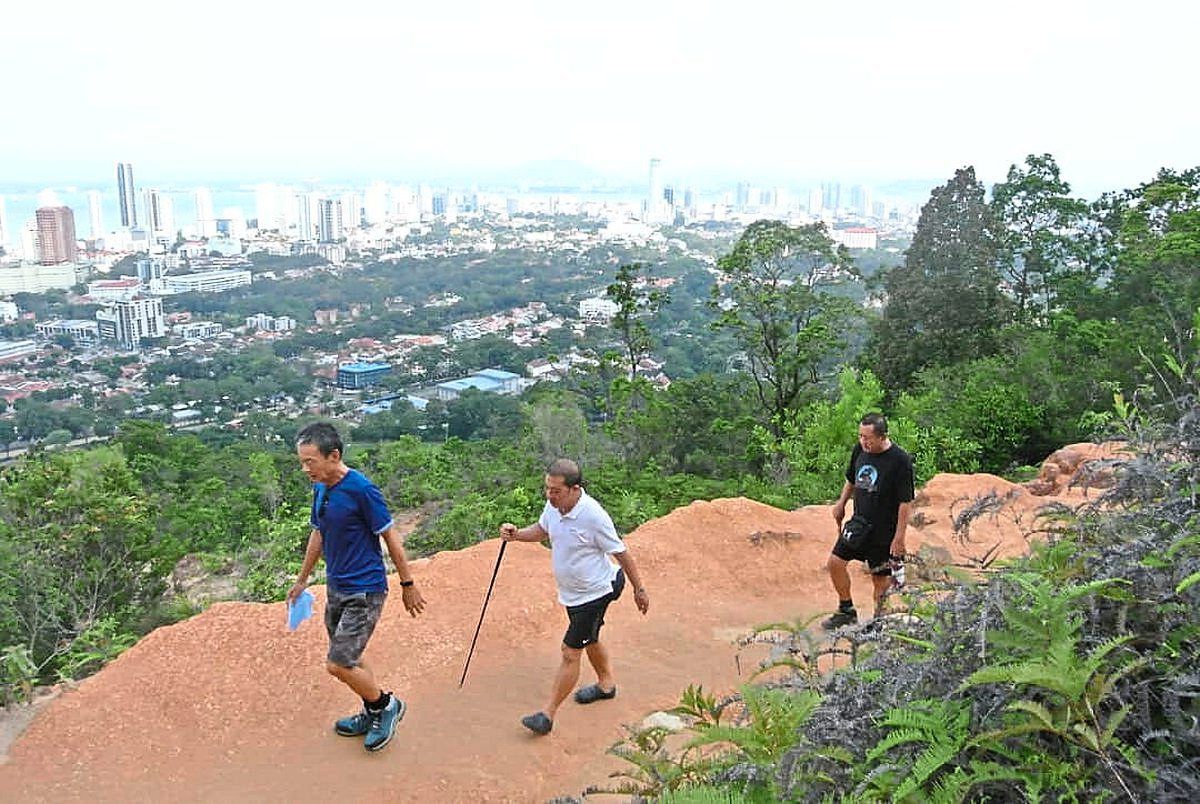 Hikers making their way up Penang Hill to the Point Five rest area. — Photos: BERNARD SEE/The Star