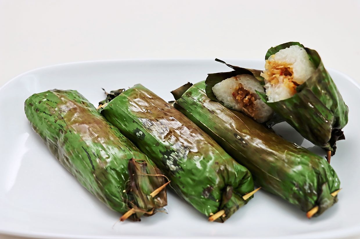 Pulut panggang is a savoury, spicy alternative to the sweet kuih usually sold at the market. — Photos: WILLIAM GARY/The Star