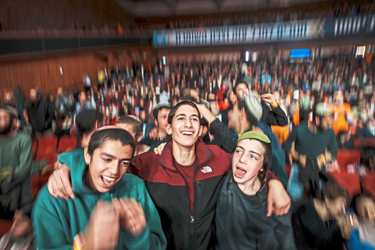 A crowd celebrating at a Jerusalem convention organised by far-right activists seeking expansion onto more Palestinian land.