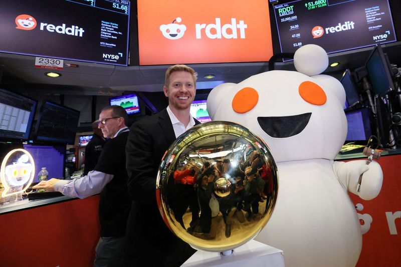 FILE PHOTO CEO of Reddit Steve Huffman stands next to Snoo the mascot of Reddit at the New York Stock Exchange NYSE in New York City U.S. March 21 2024. REUTERSBrendan McDermidFile Photo