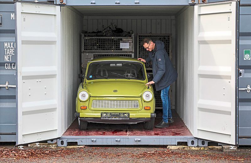 Frank Hofmann stands on the premises of his company Trabantwelt, next to a faithfully rebuilt Trabant P601. The online retailer offers all parts of the Trabant as spare parts.