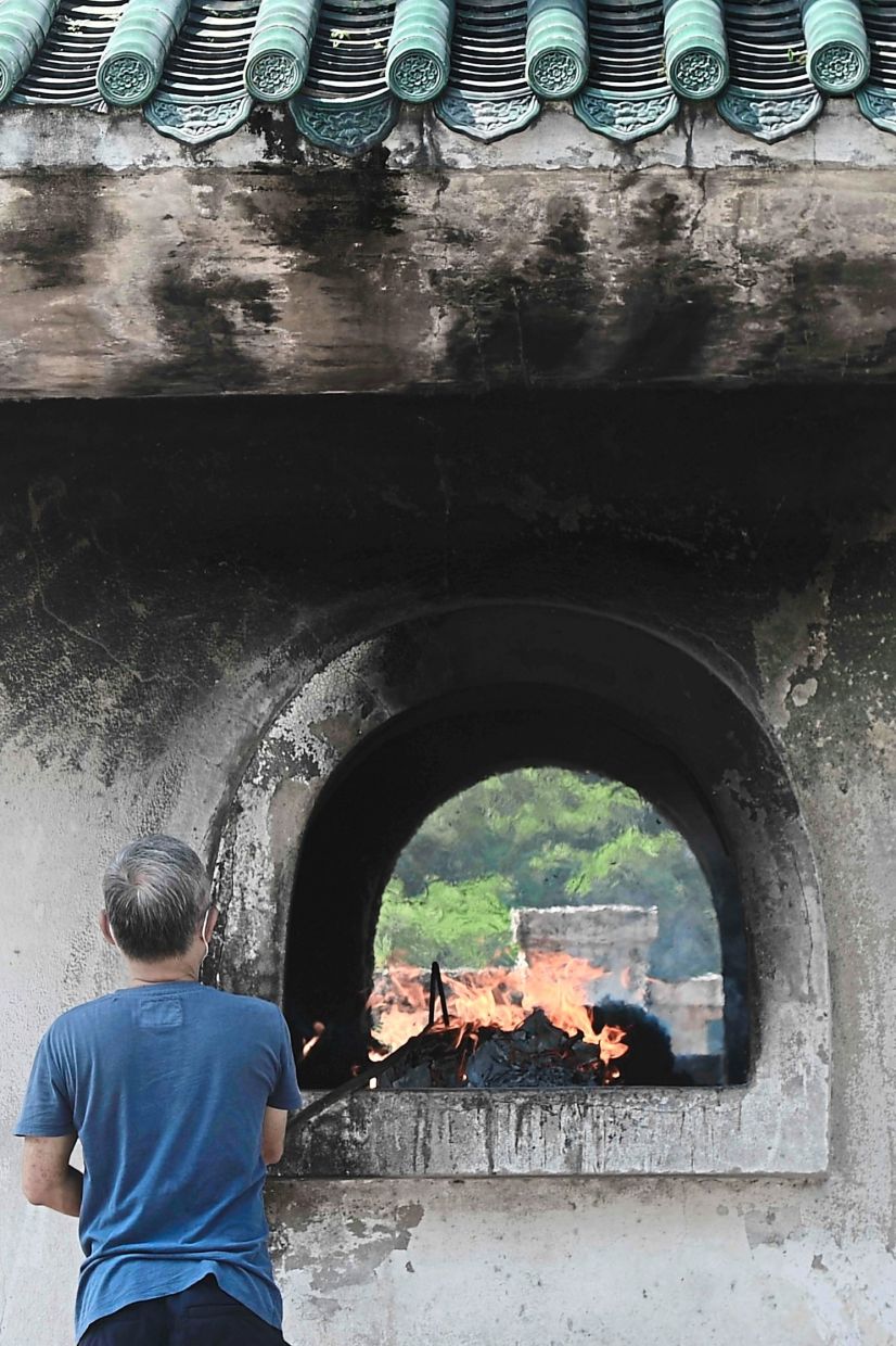 There are designated areas to burn offerings at Kwong Tong Cemetery in Jalan Dewan Bahasa in Kuala Lumpur.