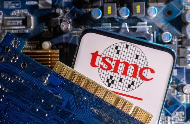 FILE PHOTO A smartphone with a displayed TSMC Taiwan Semiconductor Manufacturing Company logo is placed on a computer motherboard in this illustration taken March 6 2023. REUTERSDado RuvicIllustrationFile Photo