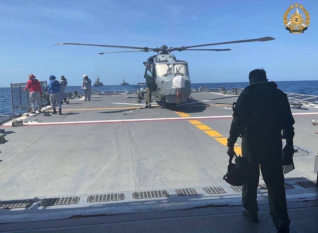 A Philippine Navy AW159 Wildcat helicopter pilot walking toward BRP Antonio Luna's helideck to conduct his pre-flight inspection procedure on the helicopter during the first Multilateral Maritime Cooperative Activity between the Philippines, US, Australia and Japan, in South China Sea. - AFP