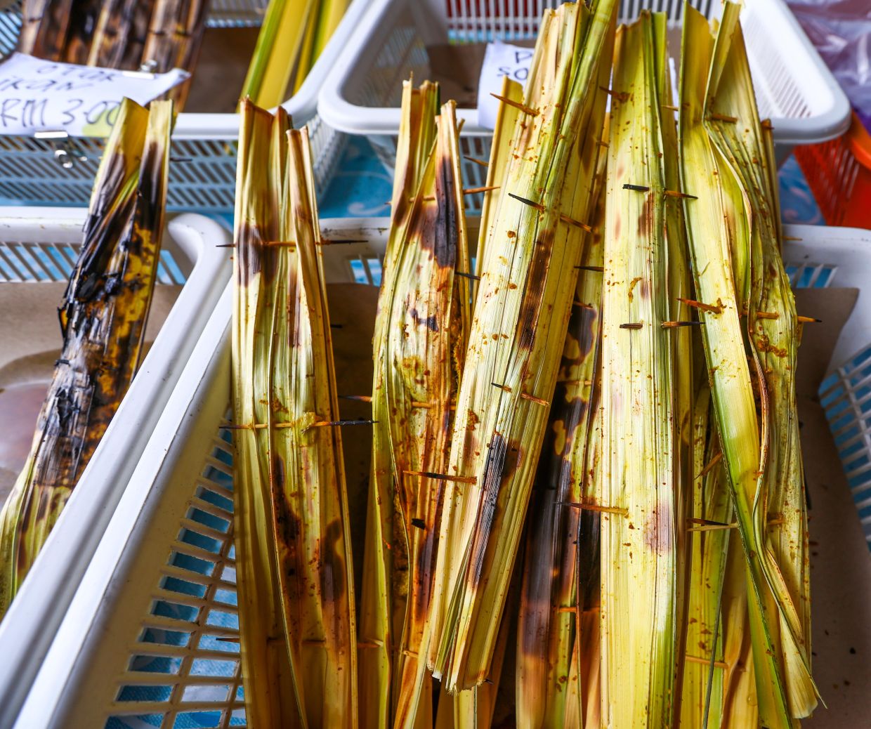 Wrapped in nipah palm leaves, pais is made from sago flour and coconut mixed with fish and other seafood. - ZULAZHAR SHEBLEE/The Star