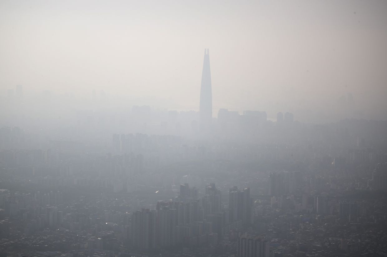123-storey skyscraper Lotte World Tower is silhouetted on a foggy day in this picture taken from an observation in Gwangju, South Korea, on Thursday, April 25, 2024. - Reuters