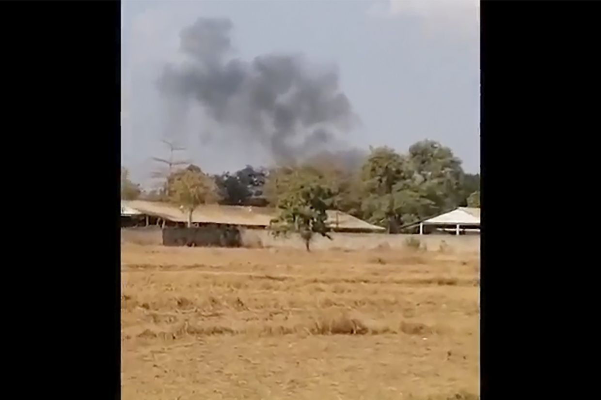 In this image from a video, smoke rises above a distant base, seen from Chbar Mon district in Kompong Speu province, Cambodia Saturday, April 27, 2024. An ammunition explosion at a base in southwestern Cambodia on Saturday afternoon killed multiple soldiers and wounded several others, Prime Minister Hun Manet said. - Chim Sothea via AP