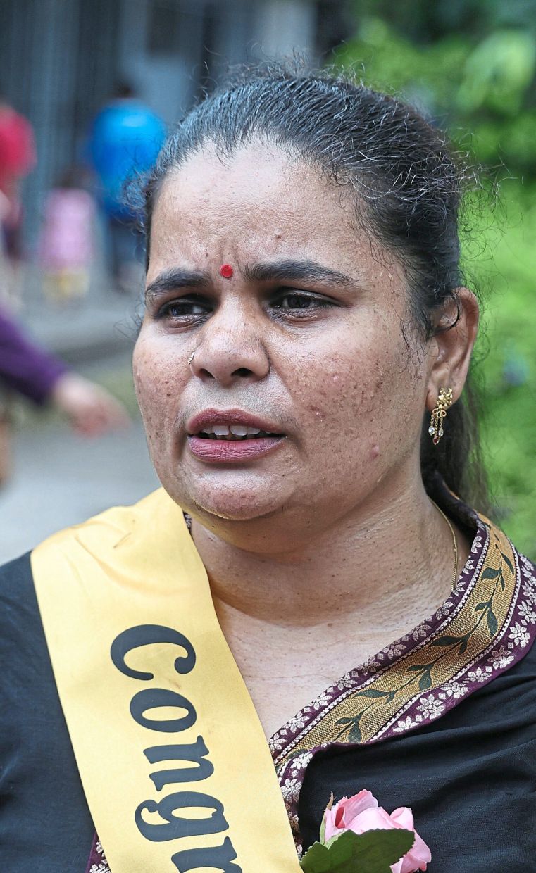 Lalitha finds joy in her flower-arrangement skills.