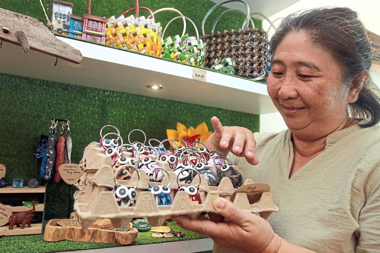 Hwang showing some of the items made from recycled waste.- Photo: RONNIE CHIN/The Star