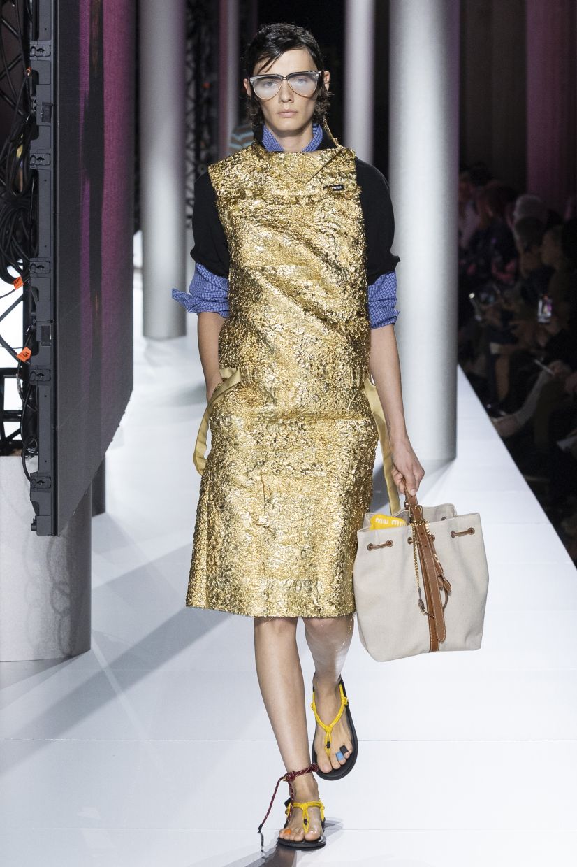 If wearing a shirt feels too commonplace, opt for a unique twist by wearing a polo shirt and a dress over it for an unconventional look. Photo: Miu Miu