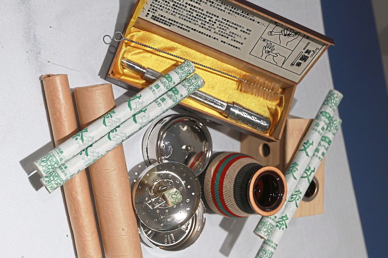 Seen here are a variety of moxa sticks and cones, along with gadgets to hold them.