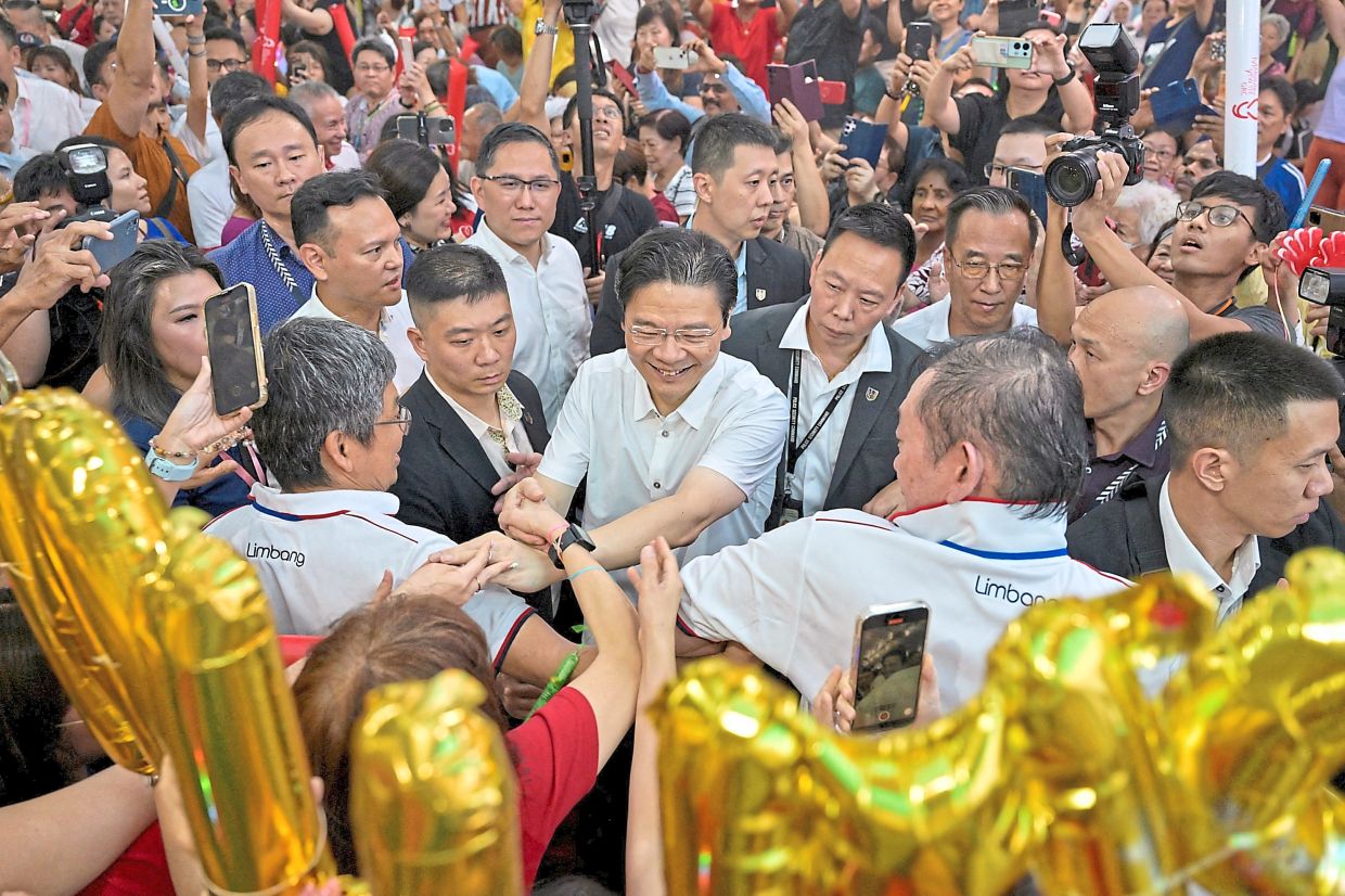 'Made in Singapore': Wong meeting supporters at a community event after the swearing-in ceremony in Singapore on May 15. — Reuters