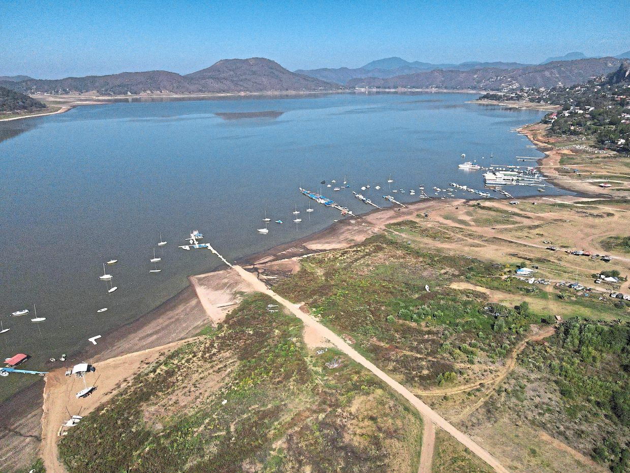 The banks of the dam lie exposed due to low water levels. According to Mexico’s National Water Commission, Valle de Bravo’s reservoir has fallen to 29% of its capacity – a historical low – compared to a year ago when it was at 52%, while the country endures a drought and has imposed restrictions on water taken from the system. — AP