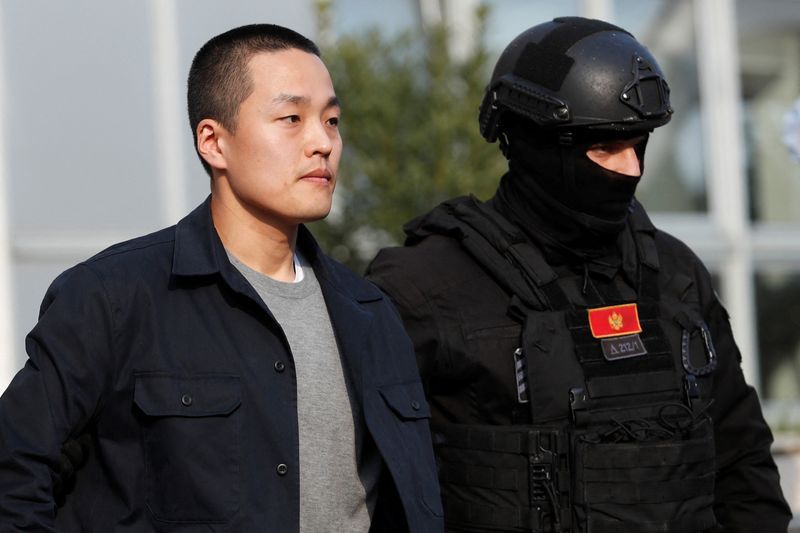 A police officer escorts Terraform Labs co-founder Do Kwon after he served a sentence for document forgery in Podgorica Montenegro March 23 2024. REUTERSStevo VasiljevicFile Photo