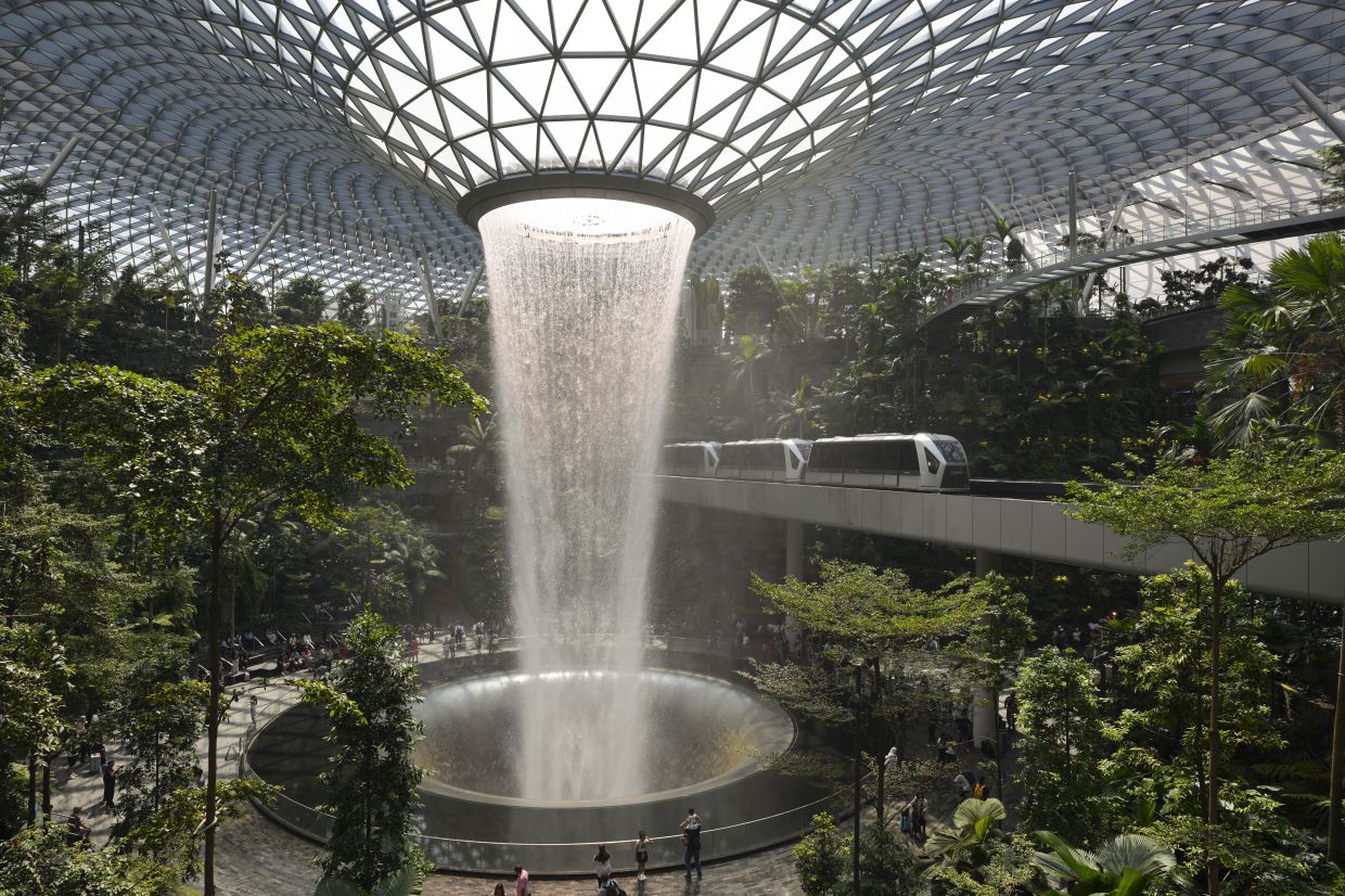 Rain Vortex is the waterfall at Jewel Changi that is known as the world's largest indoor waterfall and stands at a height of 40 meters at Jewel Changi Airport in Singapore, Monday, June 3, 2024. - AP