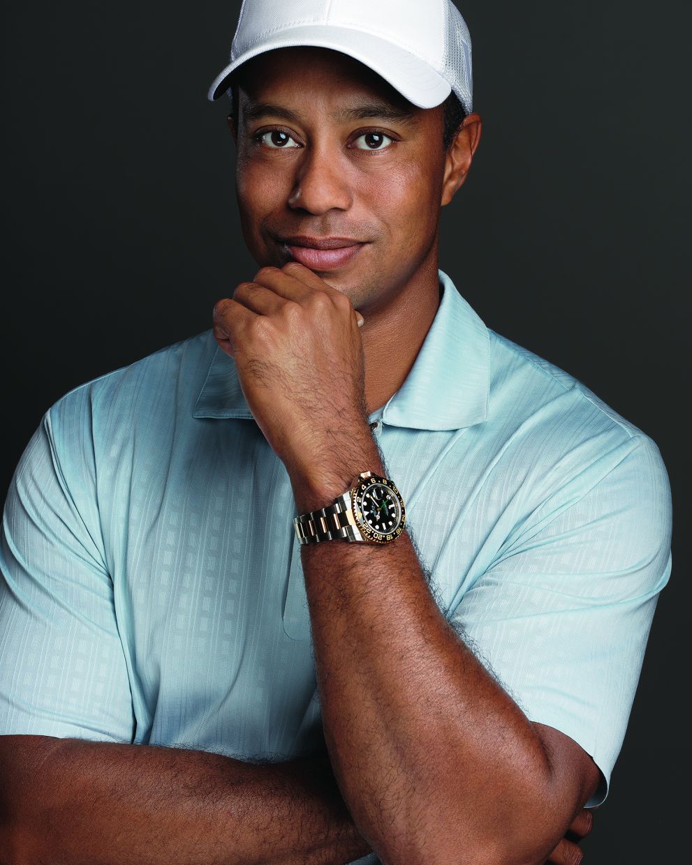Tiger Woods, golf champion and Rolex Testimonee, with a yellow Rolesor version of the GMT-Master II fitted with a black Cerachrom bezel insert in black ceramic.