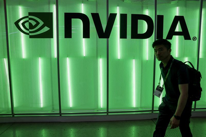 FILE PHOTO A person walks pass a Nvidia logo at Computex in Taipei Taiwan June 5 2024. REUTERSAnn WangFile PhotoFile Photo