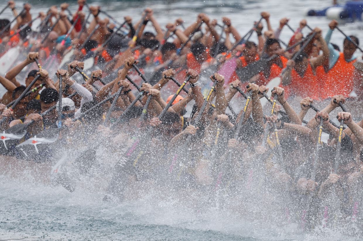 Dragon boats compete during the annual Tuen Ng, or Dragon Boat Festival, at Aberdeen fishing port in Hong Kong, China, on Monday, June 10, 2024. - Reuters